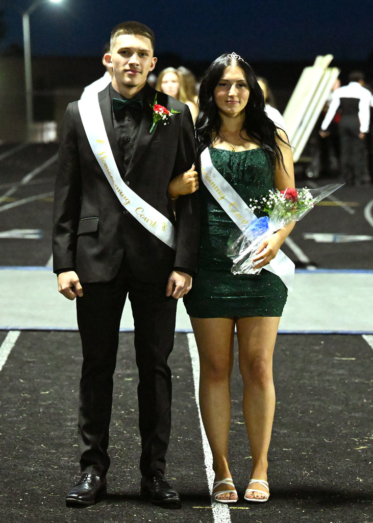 two people posing for homecoming