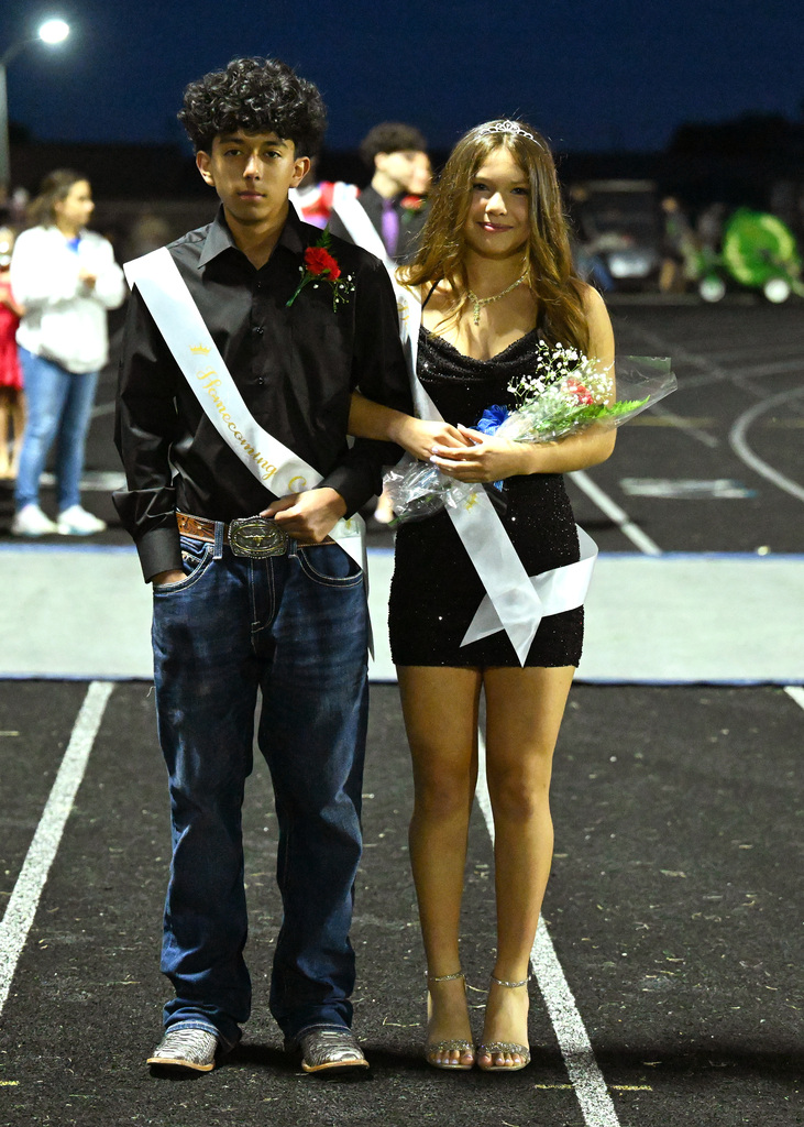 two people posing for homecoming
