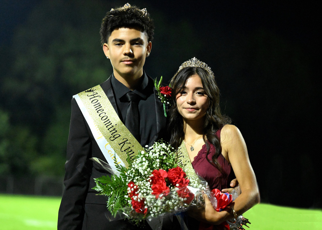 two people posing for homecoming
