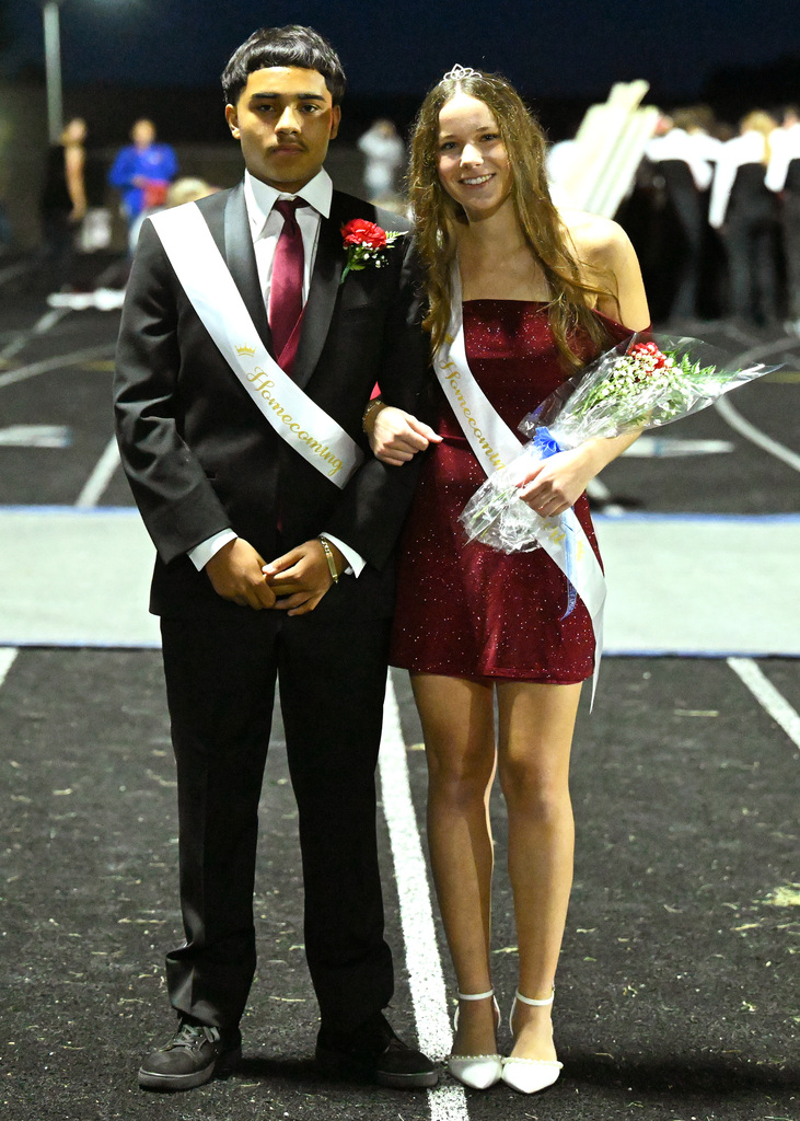 two people posing for homecoming