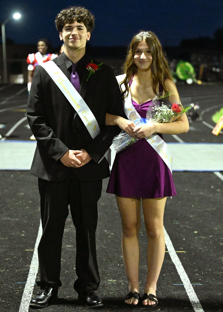 two people posing for homecoming