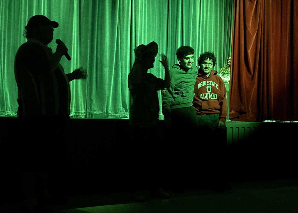 four people at a talent show