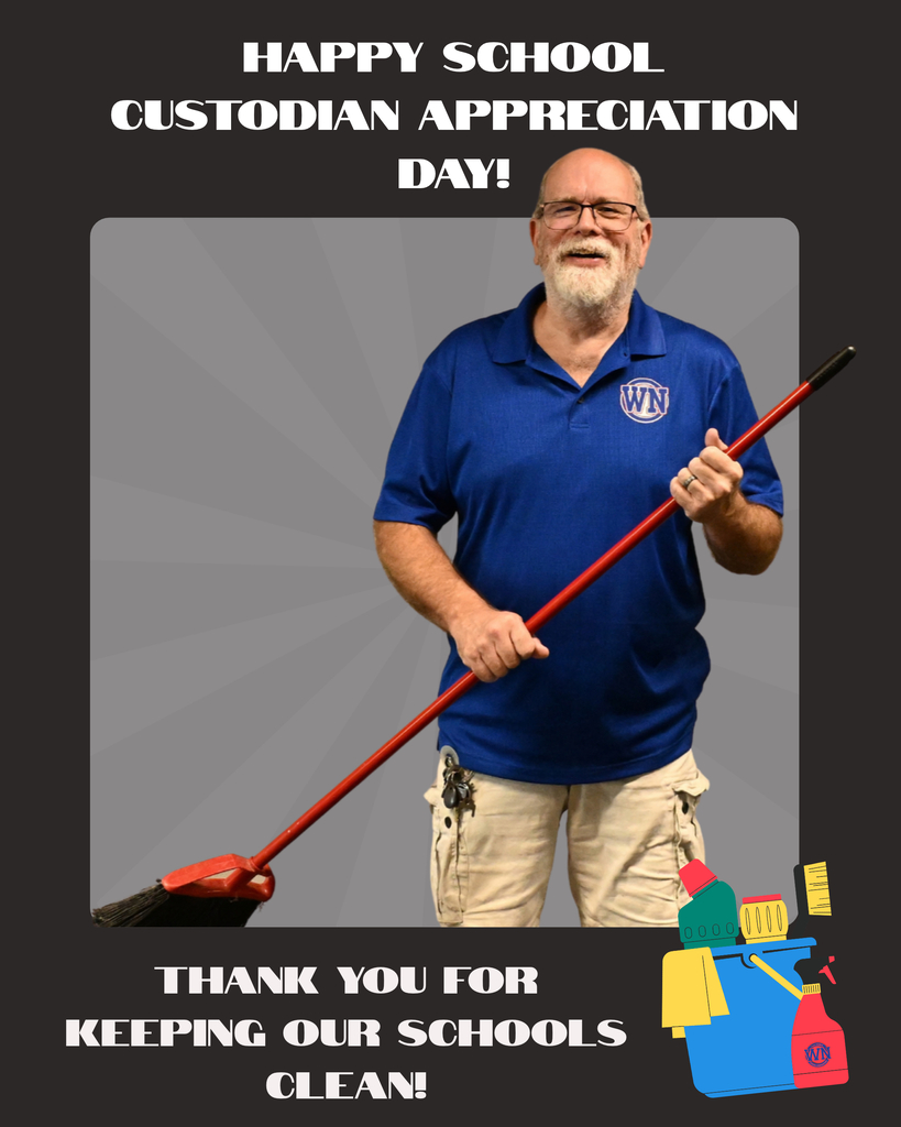 a man holding a broom in a blue shirt