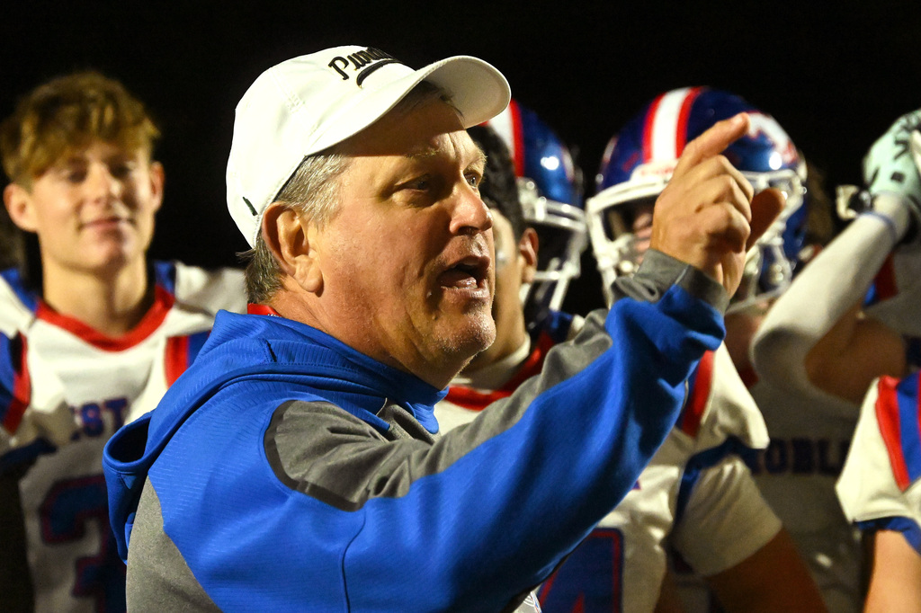 a coach talking to his team