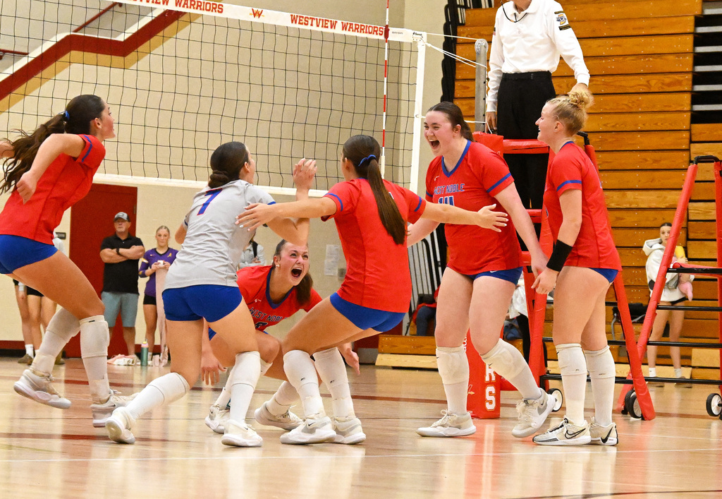 girls playing volleyball