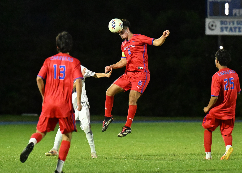 soccer player heading a ball