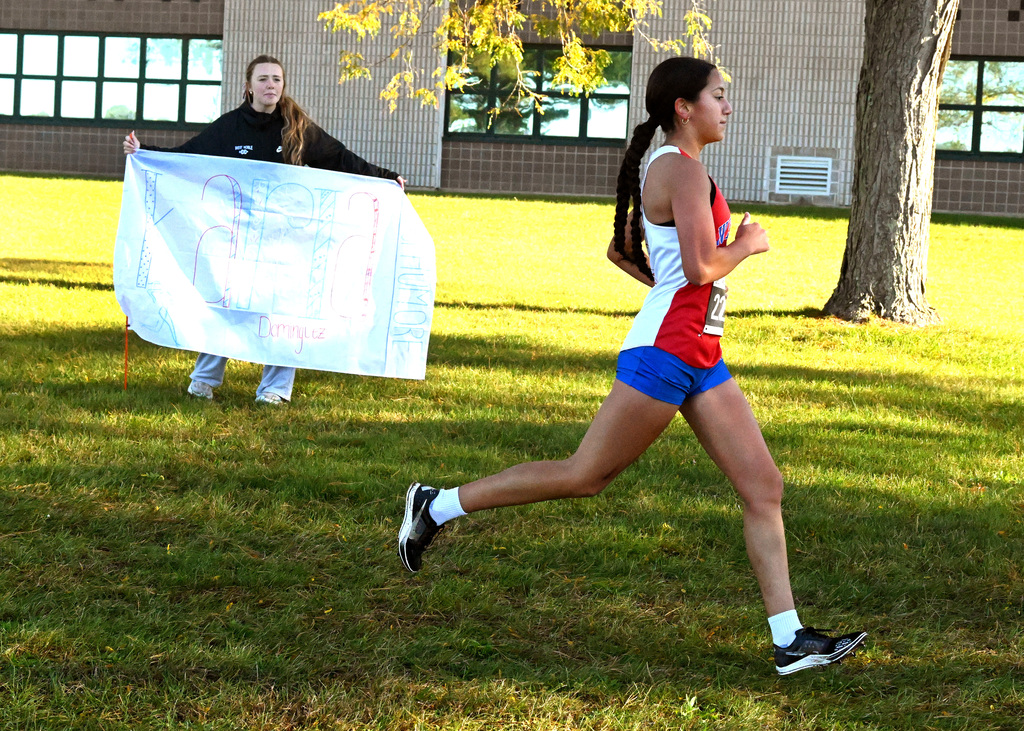 girls running on a cross country course