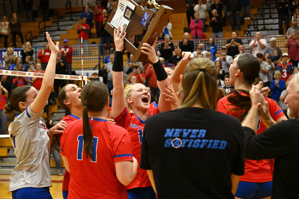 team celebrating a sectional title