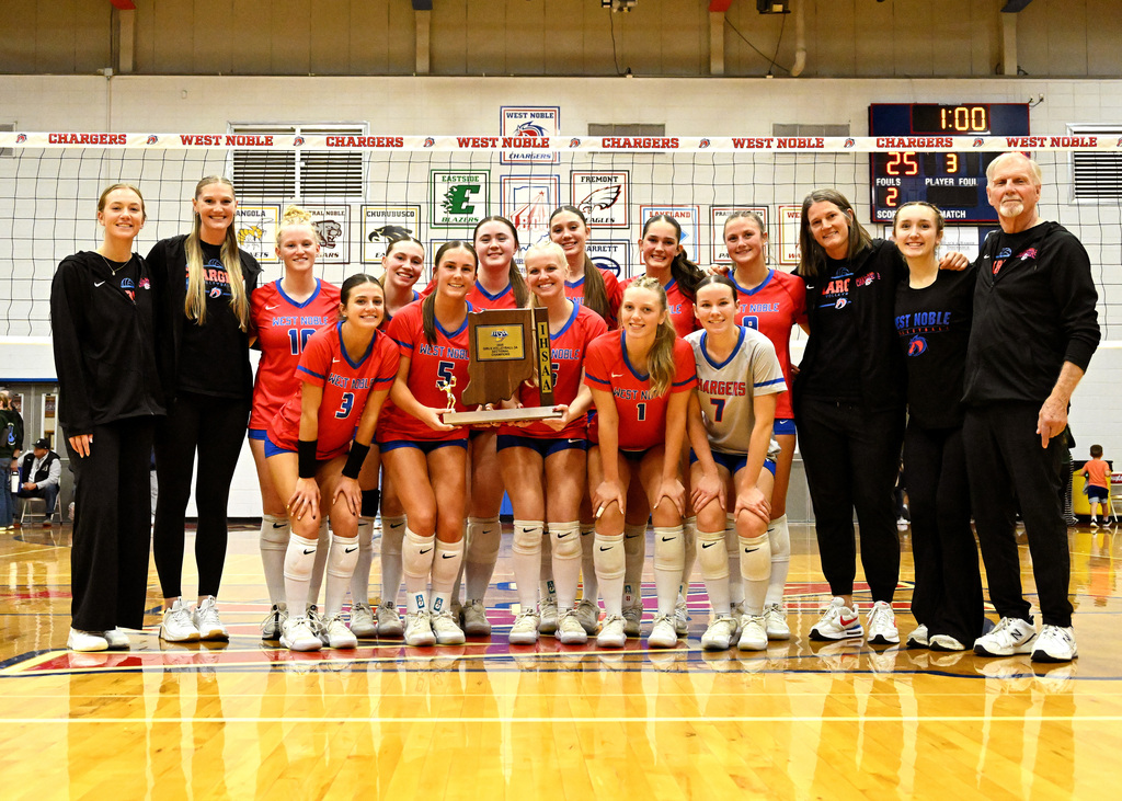 team posing with a trophy