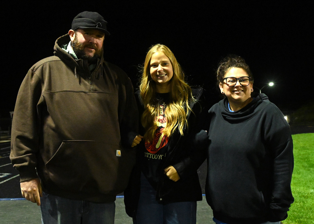 three people posing for a picture