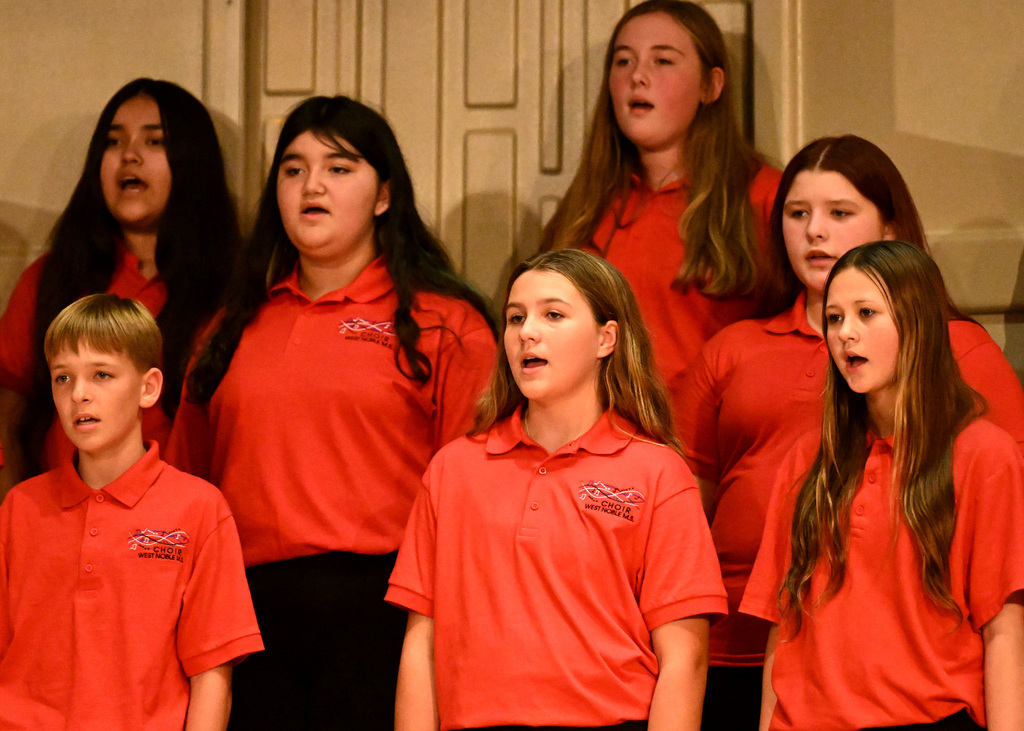 seven people singing in the choir