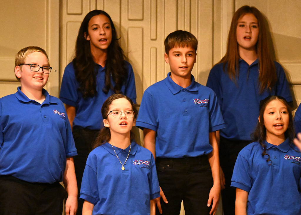 six people singing in the choir