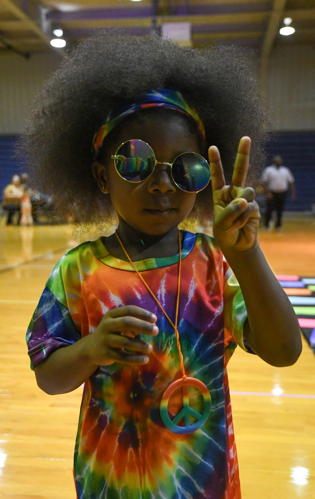 kid in hippie attire