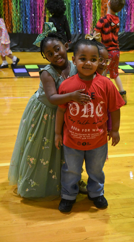 kids hugging at school dance