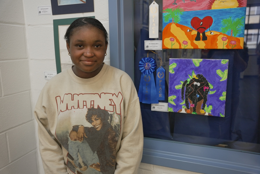 students presenting artwork at WOSMS art show