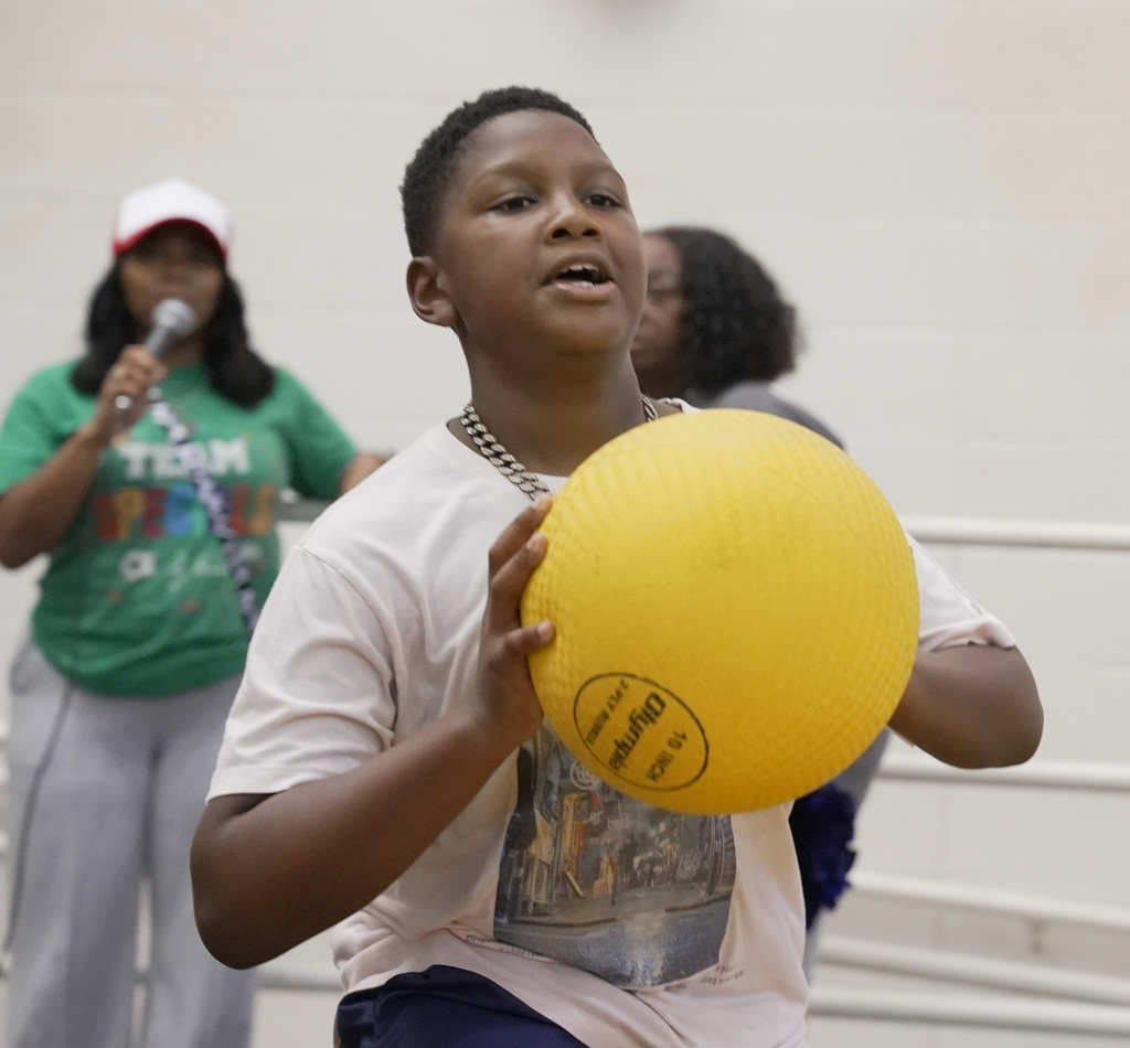 boy holding ball at WOSE kickball game