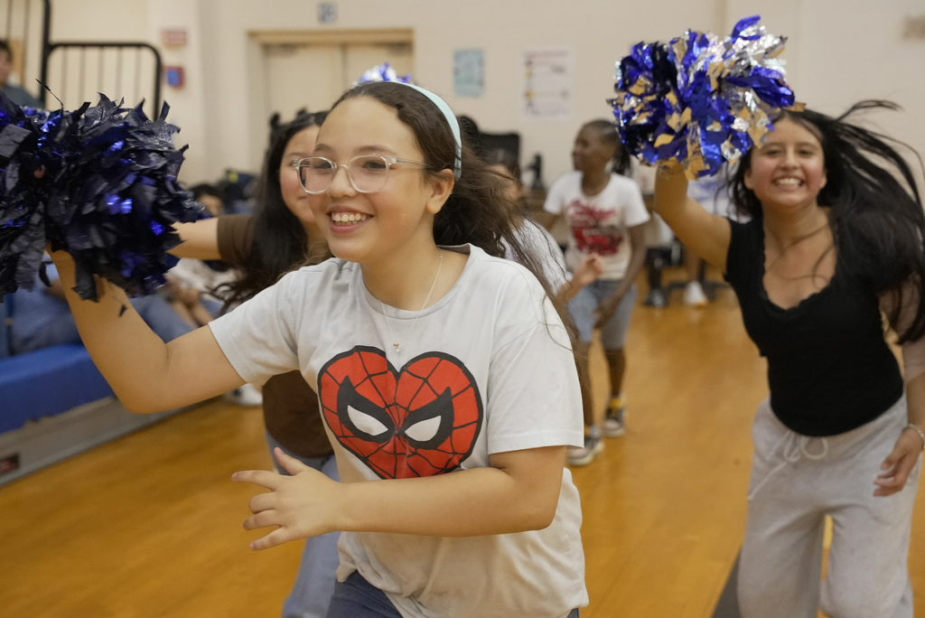 cheerleaders running at WOSE kickball game