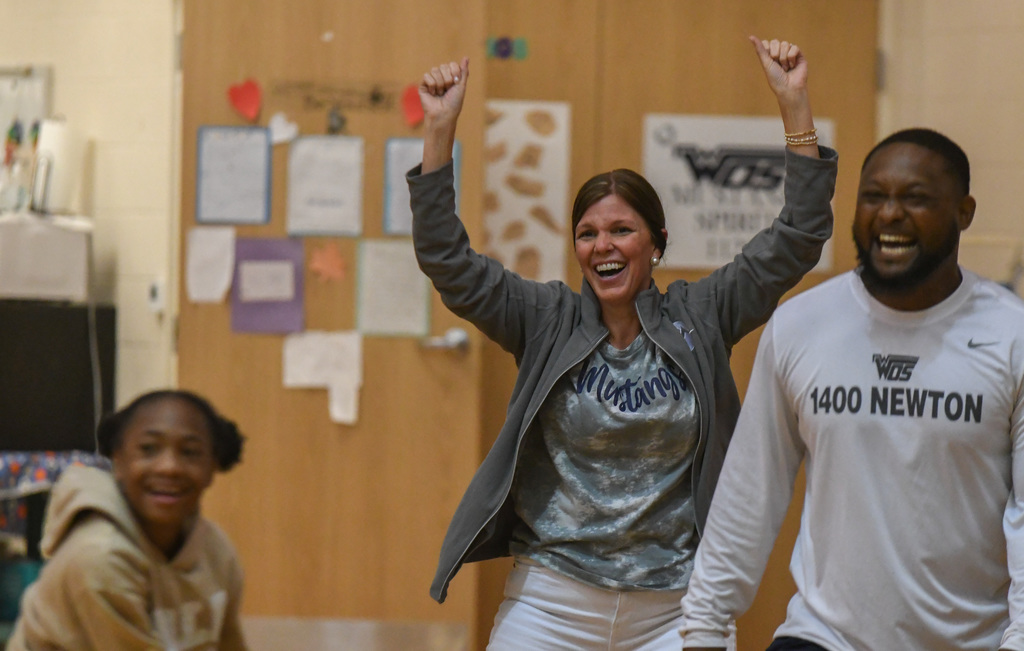 principal cheering at WOSE kickball game