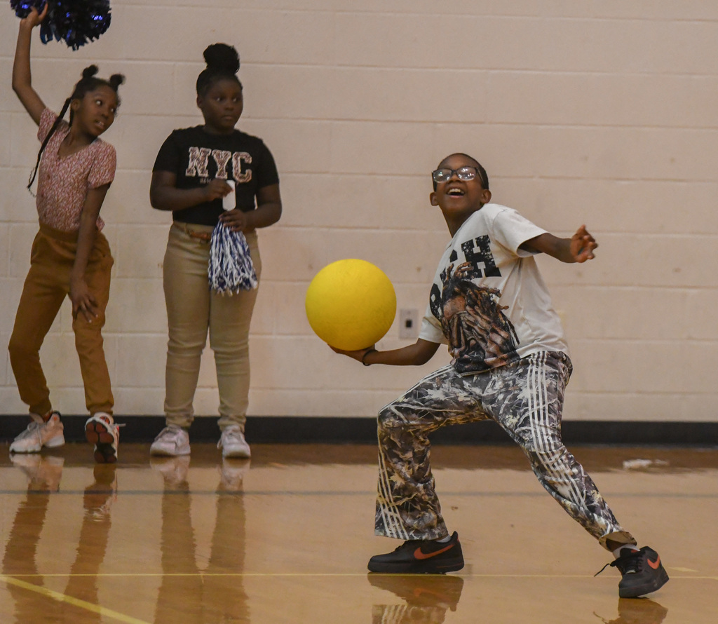 boy throwing ball at WOSE kickball game