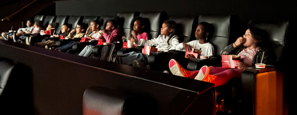 students at a theater to watch The Sheep Detectives