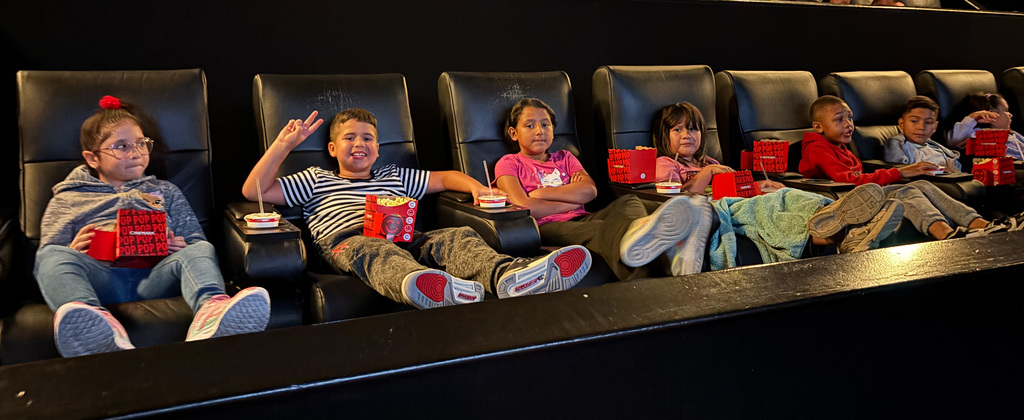 students at a theater to watch The Sheep Detectives