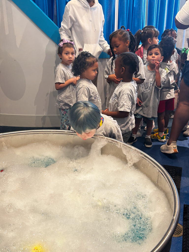 Students lined up for a bubble tub exhibit