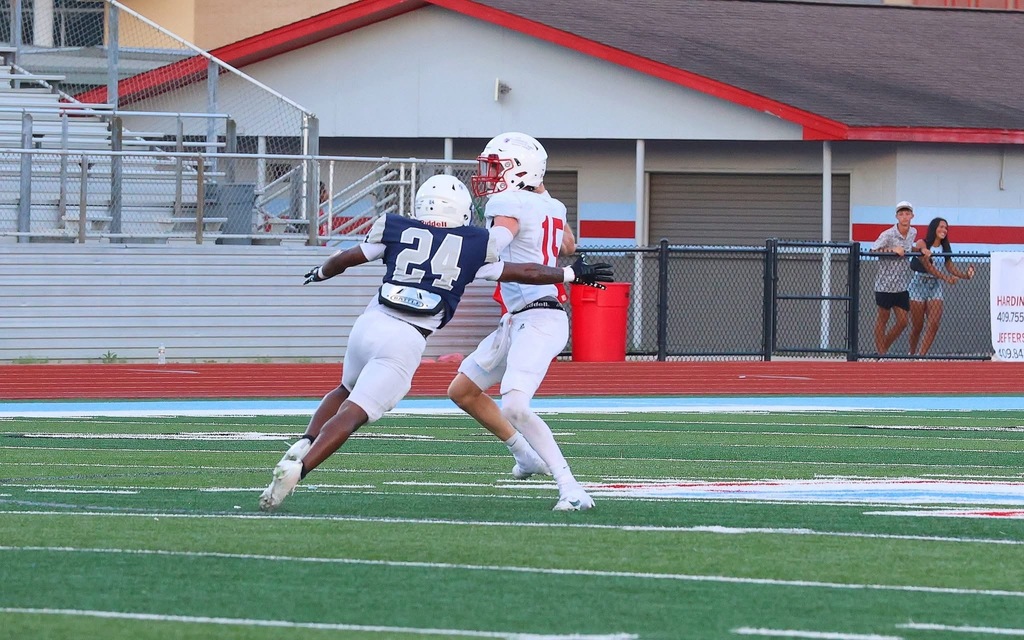 WOS player going for a Quarterback tackle