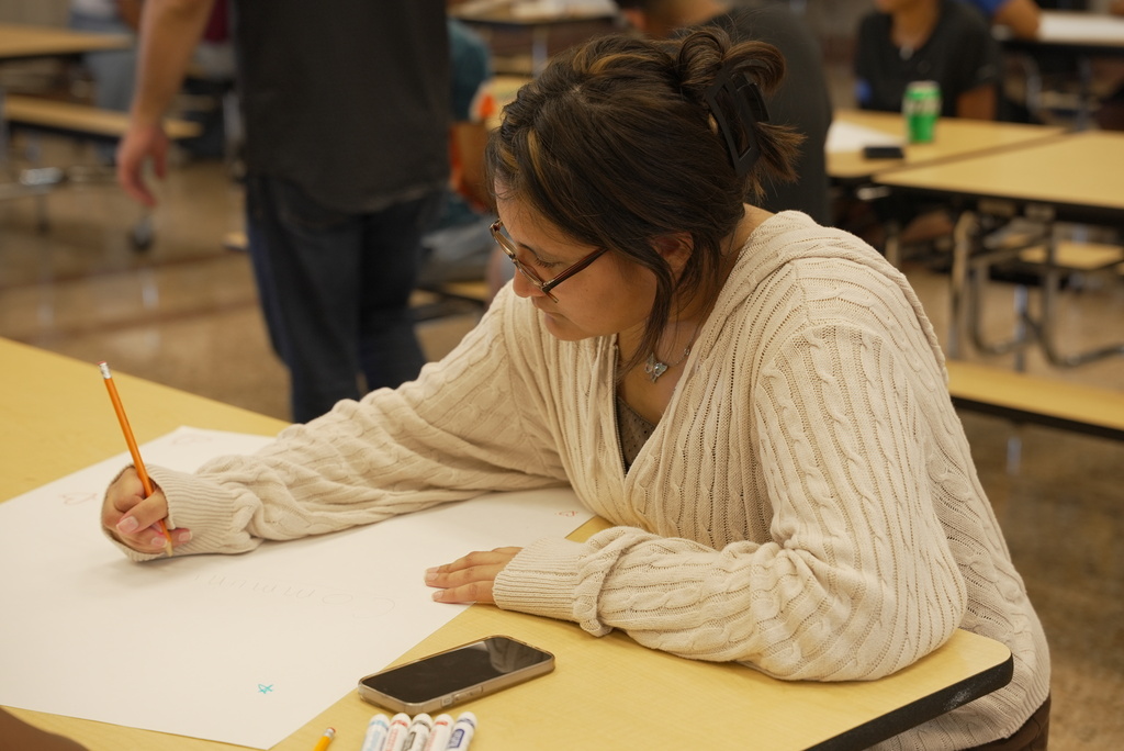 Student making poster