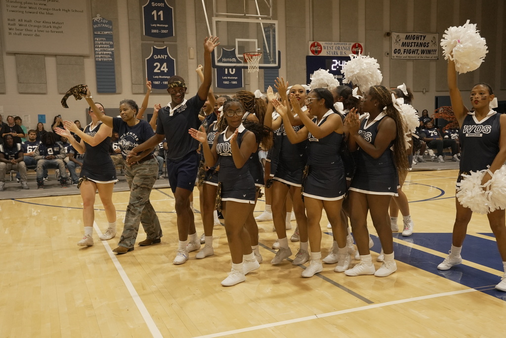 Cheerleaders celebrating Superintendent Dr. Sigee's birthday