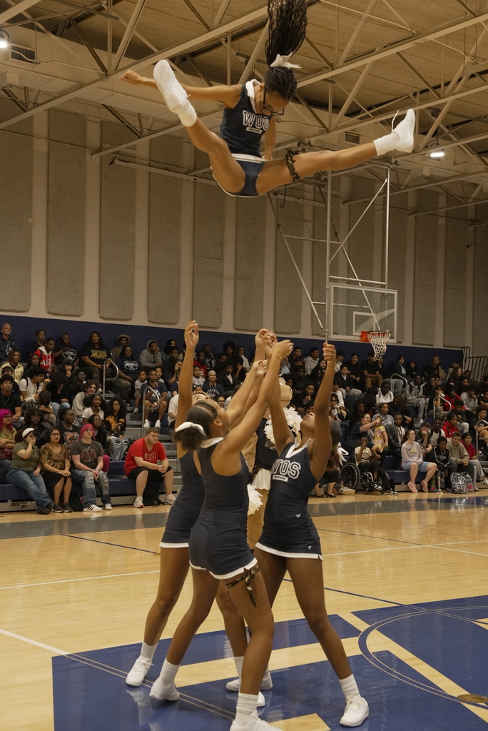 Cheerleader in a high toss