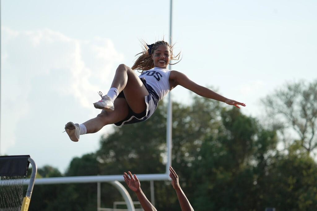 WOS Cheerleader mid falling into basket