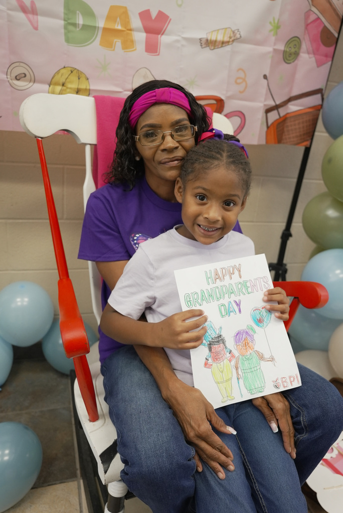 Grandparent and children at school event