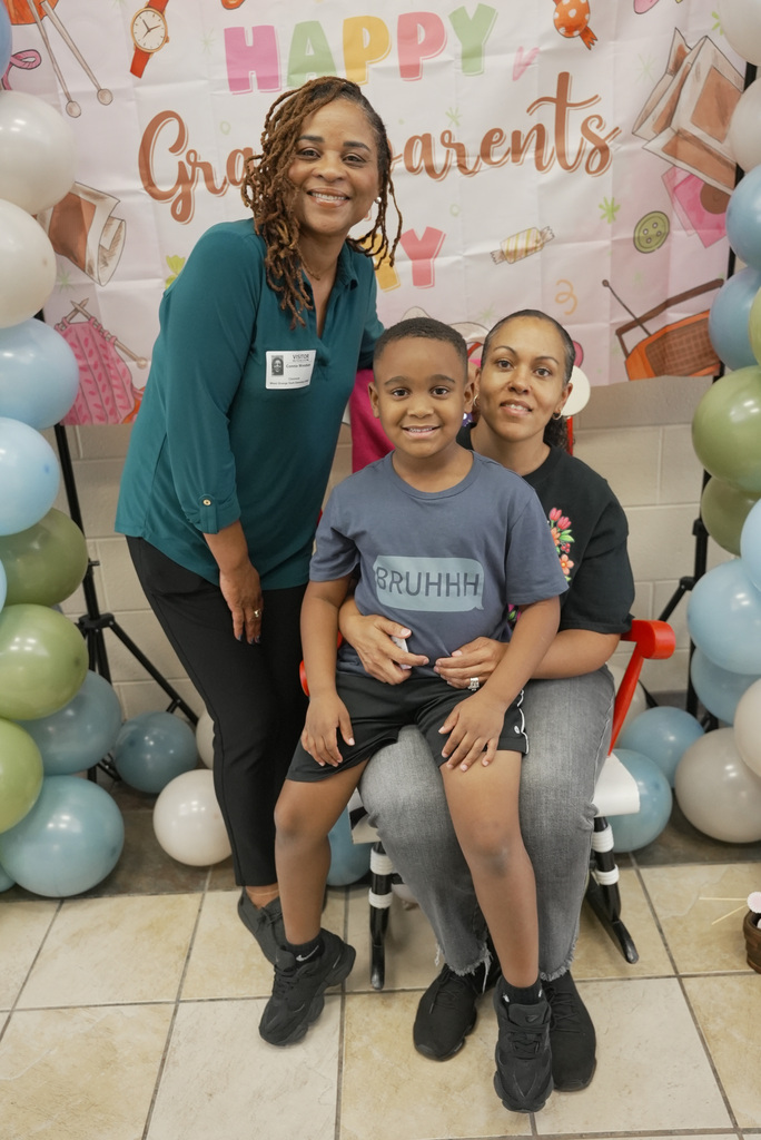Grandparent and children at school event