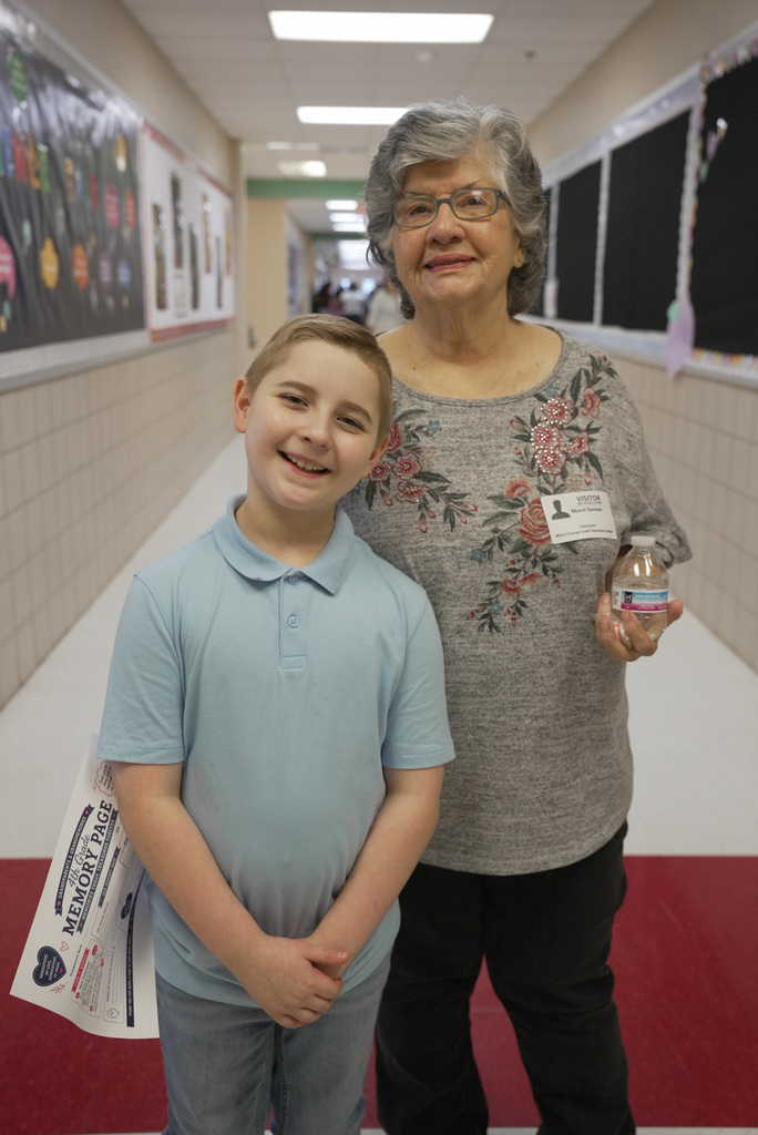Grandparent and children at school event