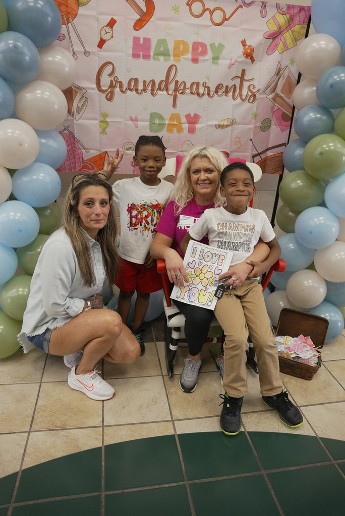 Grandparent and children at school event