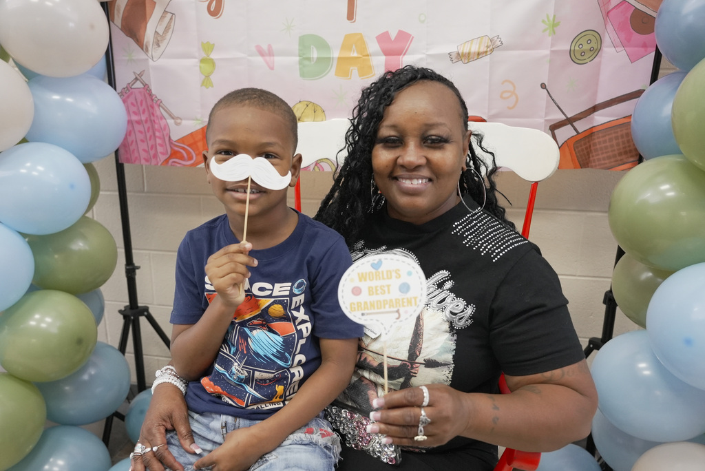 Grandparent and children at school event