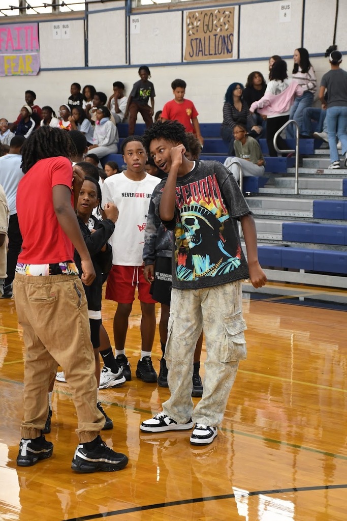 A group of students dancing in the gym