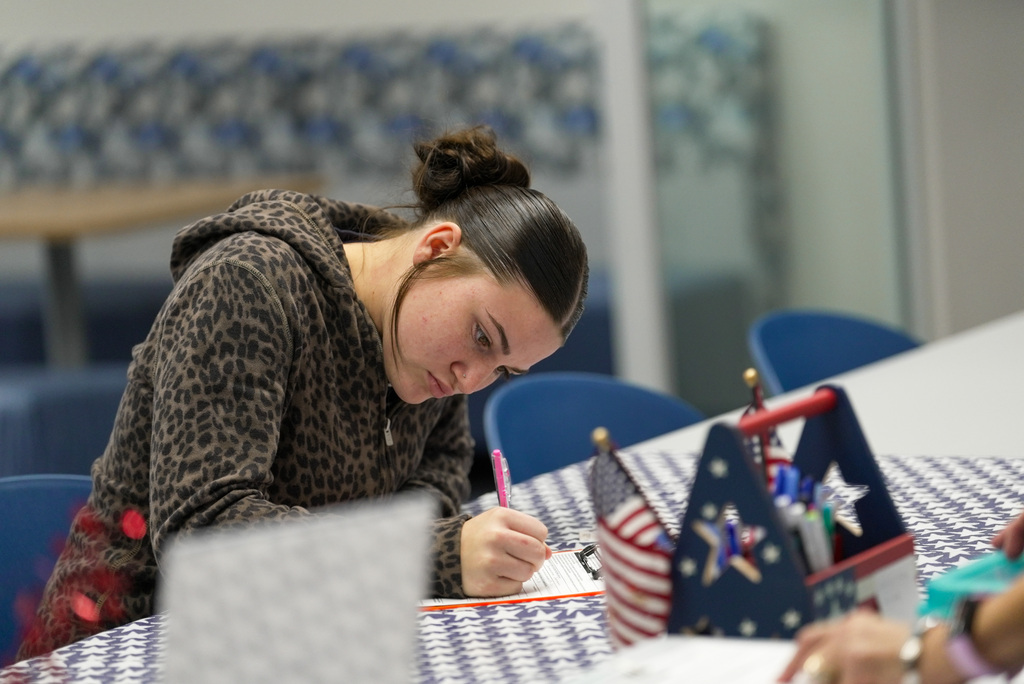 female student filling out voter registration form