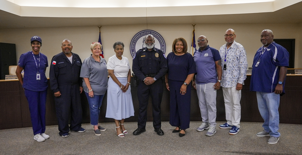 WOCCISD Board of Trustees standing with newly sworn in WOCCISD police officer Kenneth Breakfield