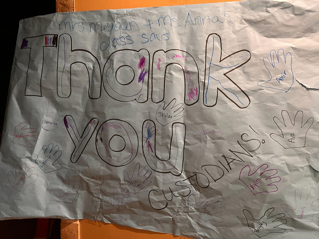 Artwork with handprints thanking custodial staff at NELC