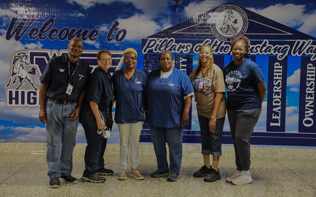 WOSHS custodians taking a group photo