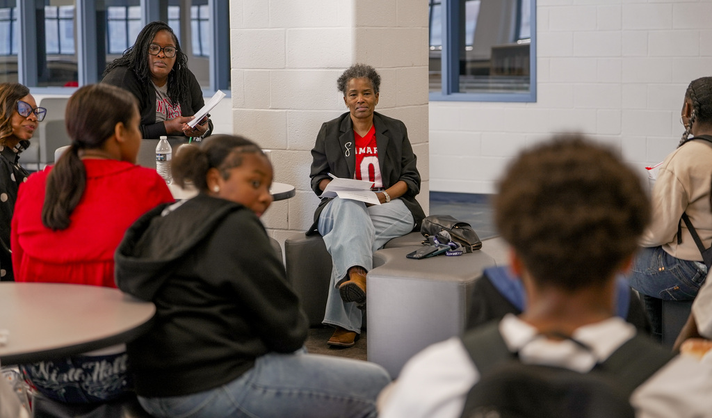 Dr. Sigee listens to a student give a siggestion