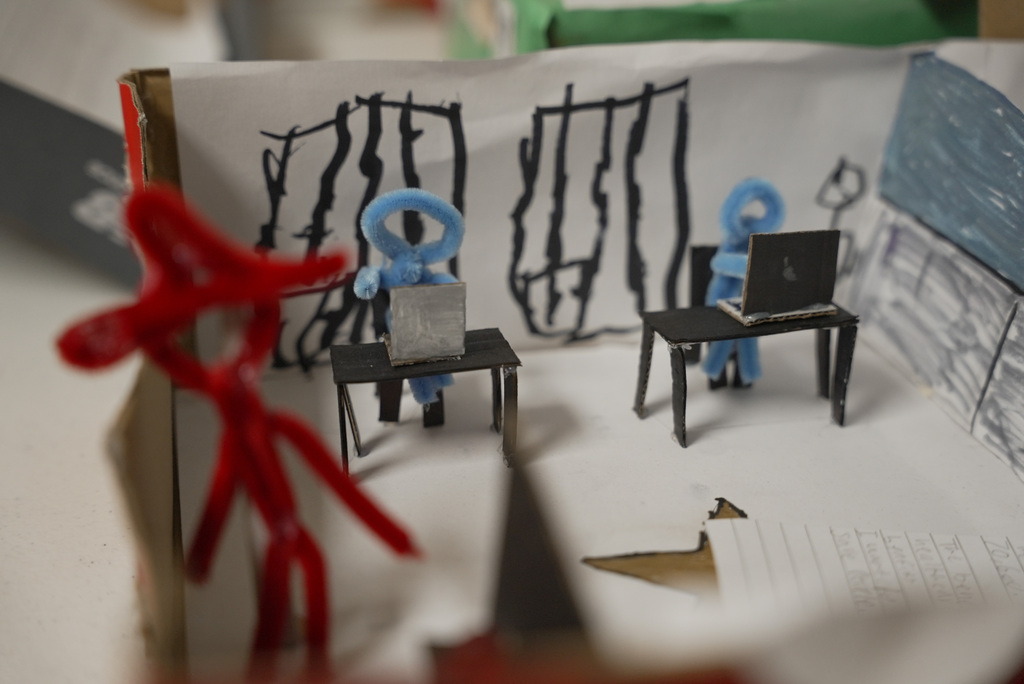 pipe cleaner figures working on computers
