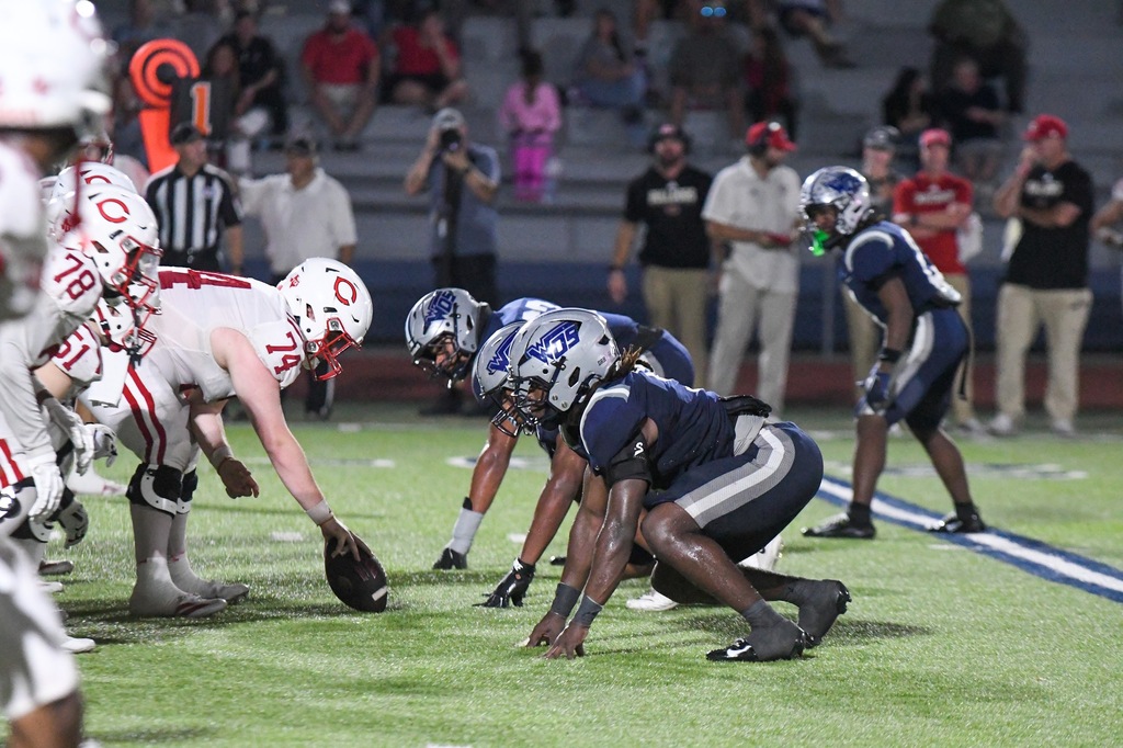 WOS defensive line waiting for the snap
