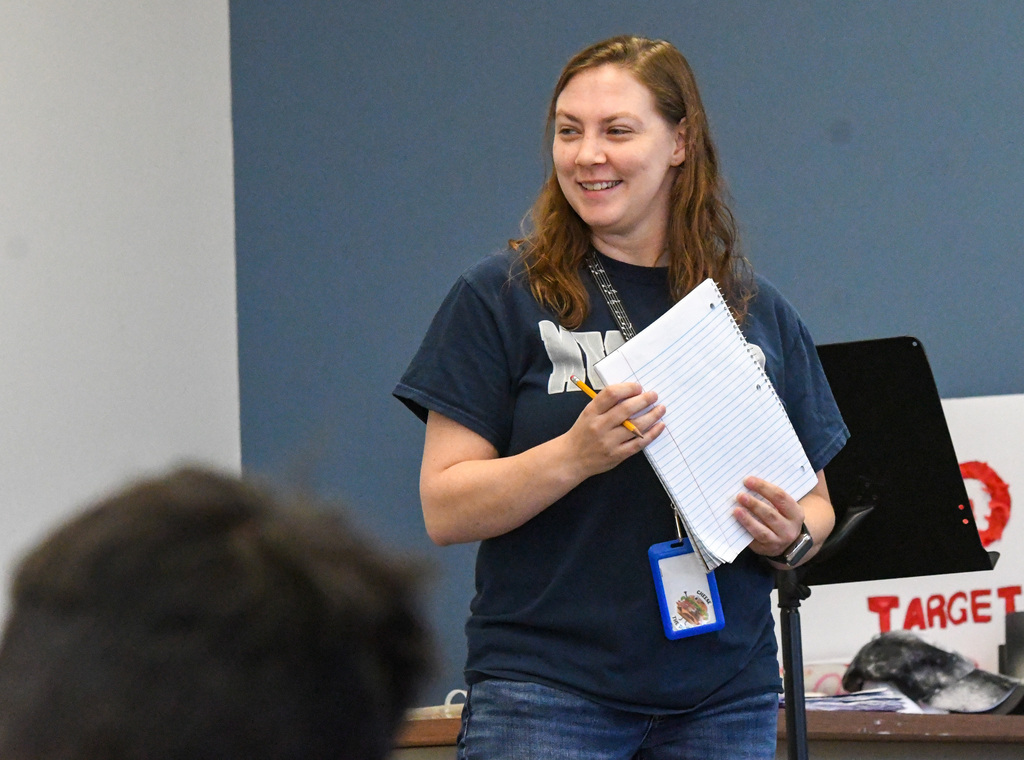 Theatre teacher smiling and listening to students