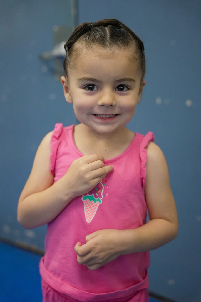 a girl with her new haircut smiling