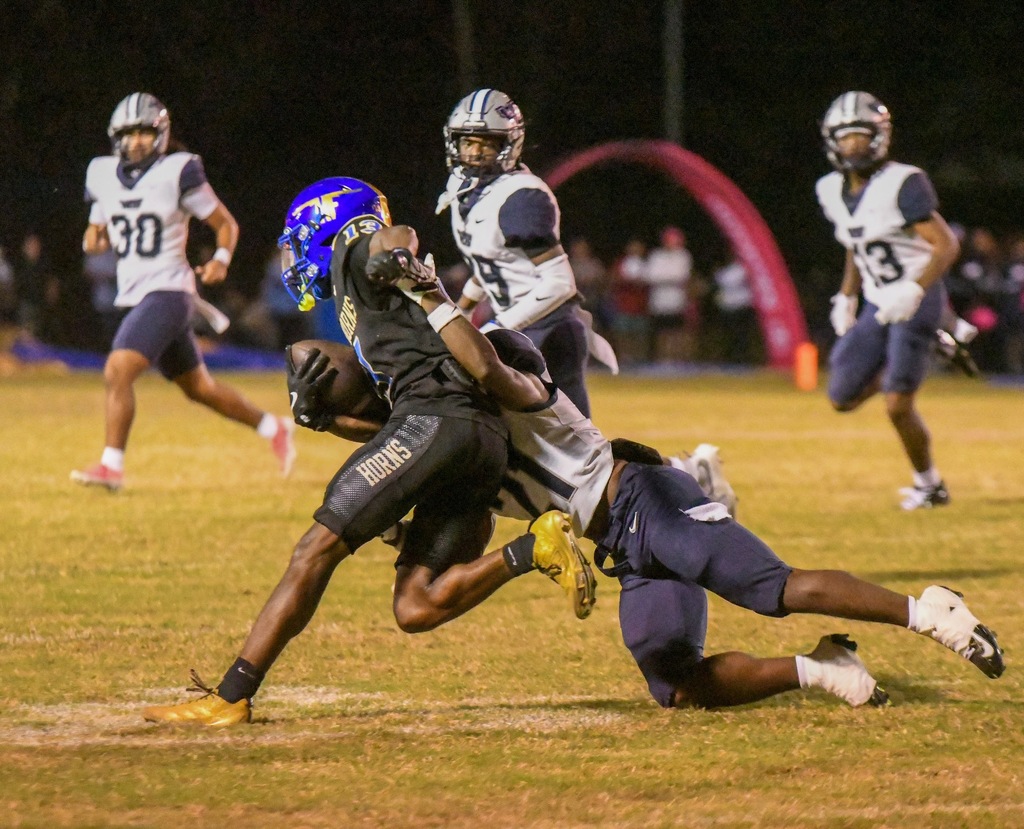 #21 holds onto the opposing ball runner