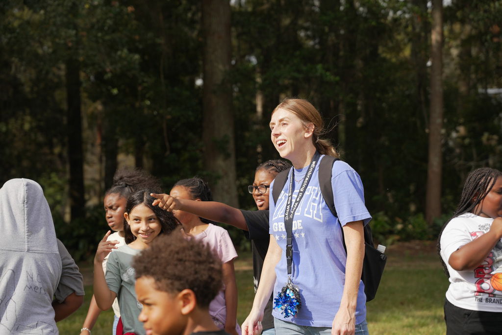 students and teacher observe wildlife