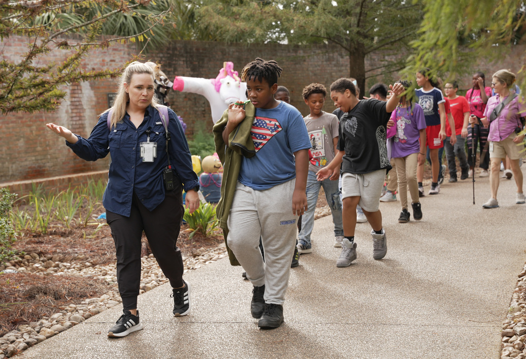 guide leading students down a path