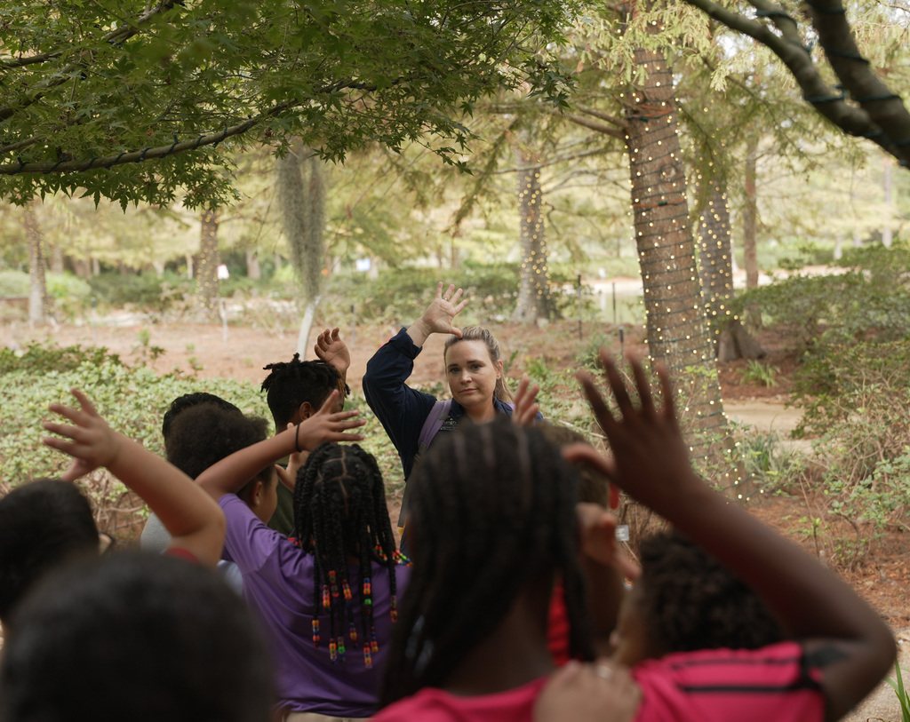park staff having students raise hands